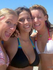 Hot busty brunette gets playful with her bikini friends