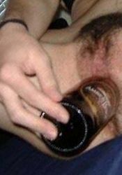 Photo gallery of an amateur wild hottie fucking her cunt with a bottle