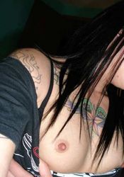 Photo selection of an amateur tattooed babe dildoing her twat