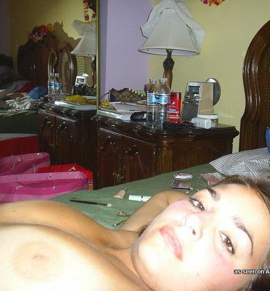 Photos of a busty amateur babe camwhoring in the nude
