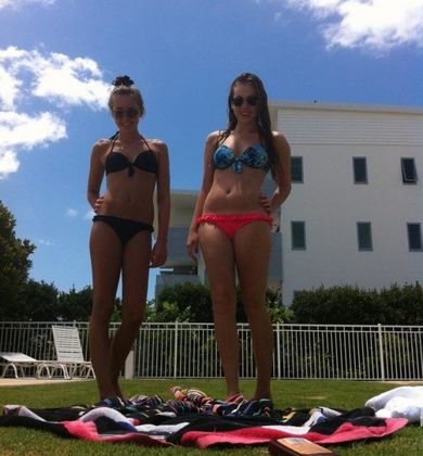 Pictures of a sexy bikini teen posing with her friends