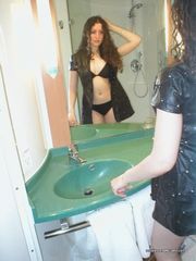 Pictures of a sexy chick posing sleazy in a motel room