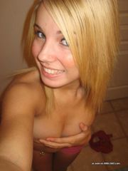 Steamy hot topless blonde self-shooting in the bathroom
