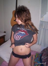 Busty 19 year-old amateur rocker chick poses like a slut