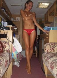 Hot brunette modeling her lingerie in her trailer home